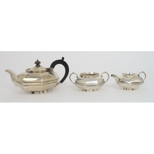 902 - A THREE PIECE SILVER TEA SERVICE