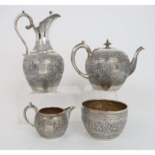 910 - A FOUR PIECE SILVER TEA SERVICE