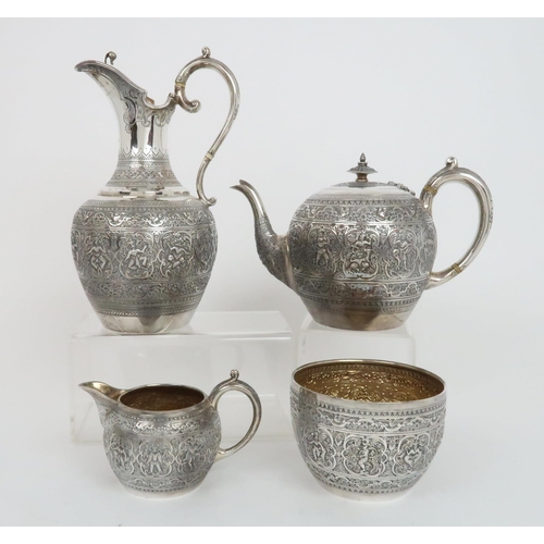 910 - A FOUR PIECE SILVER TEA SERVICE