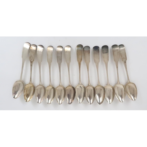 921 - A SET OF TWELVE SILVER TABLESPOONS