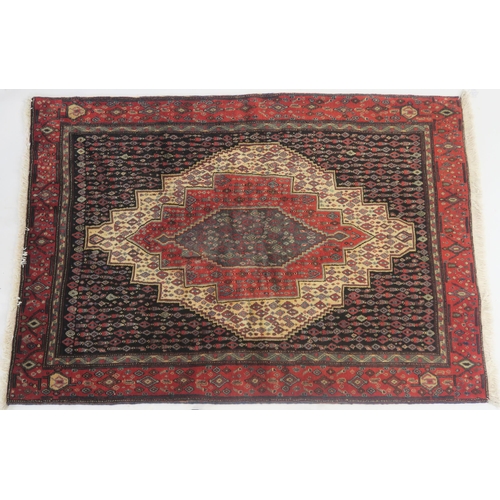 103 - A BLACK GROUND SENNEH RUG