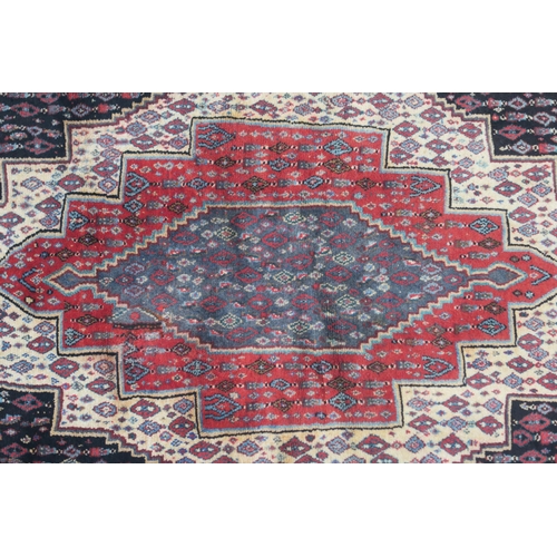 103 - A BLACK GROUND SENNEH RUG