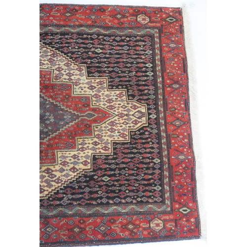 103 - A BLACK GROUND SENNEH RUG