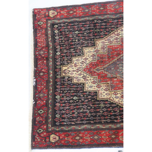 103 - A BLACK GROUND SENNEH RUG