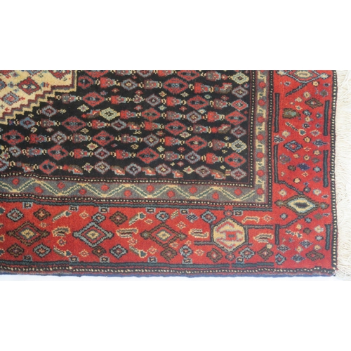 103 - A BLACK GROUND SENNEH RUG