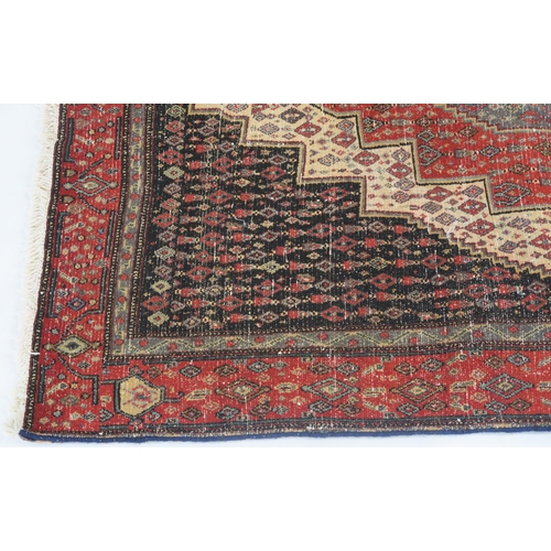 103 - A BLACK GROUND SENNEH RUG