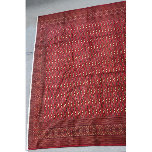 104 - A RED GROUND TURKMAN RUG