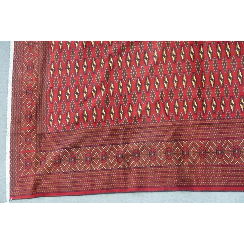 104 - A RED GROUND TURKMAN RUG