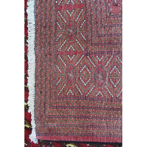 104 - A RED GROUND TURKMAN RUG