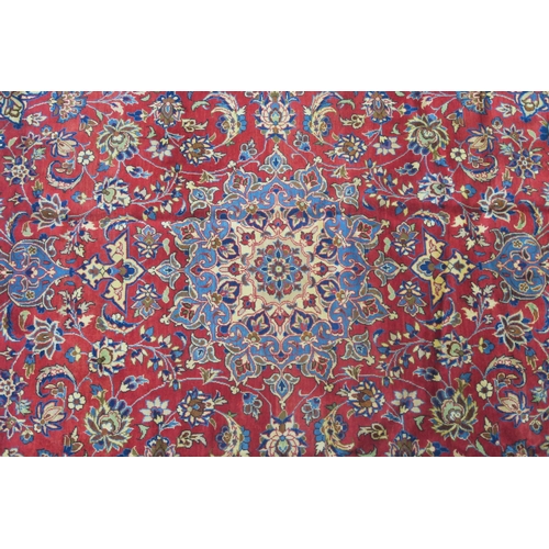 105 - A RED GROUND NAJAF ABAD RUG