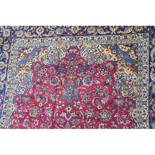 105 - A RED GROUND NAJAF ABAD RUG