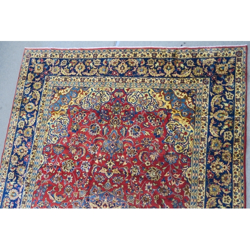 105 - A RED GROUND NAJAF ABAD RUG