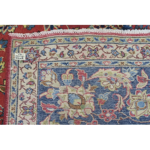 105 - A RED GROUND NAJAF ABAD RUG