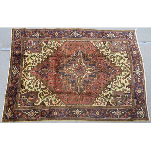 106 - A CREAM AND TERRACOTTA GROUND HERIZ RUG