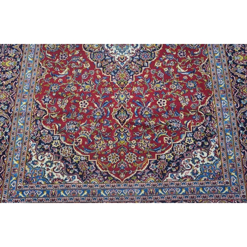 108 - A RED GROUND FINE KESHAN RUG