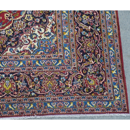 108 - A RED GROUND FINE KESHAN RUG