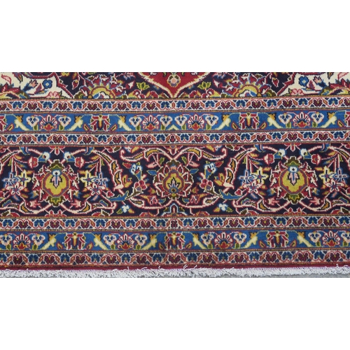 108 - A RED GROUND FINE KESHAN RUG