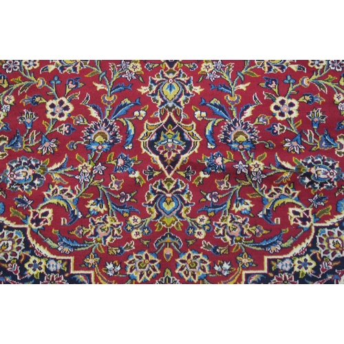 108 - A RED GROUND FINE KESHAN RUG