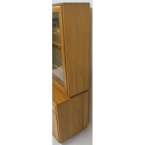 137 - AN ELM ERCOL 2149 DISPLAY CABINET ON CUPBOARD BASE