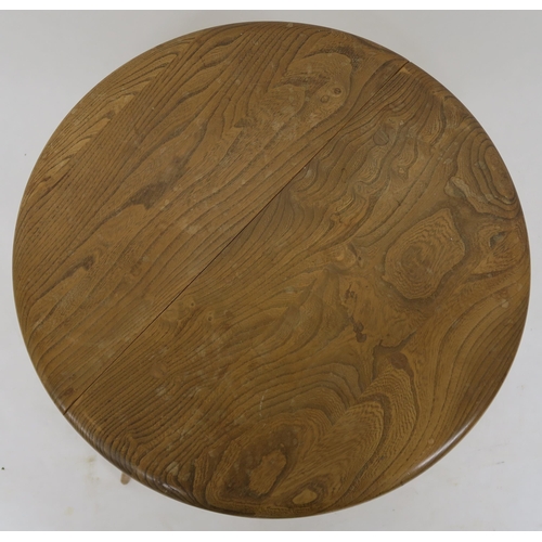 138 - A MID CENTURY ELM & BEECH ERCOL 308 CIRCULAR DROPLEAF TABLE