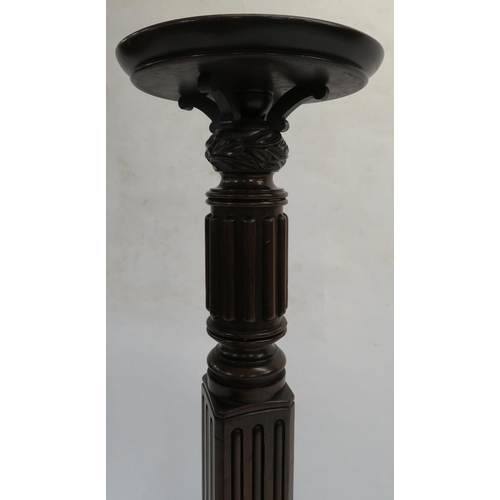 70 - AN EARLY 20TH CENTURY WALNUT TUSCAN COLUMN PEDESTAL