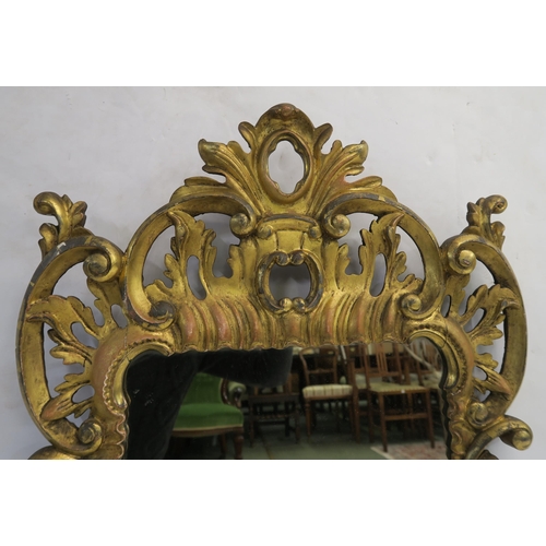 74 - A GEORGIAN DESIGN ROCOCO STYLE GILT MIRROR