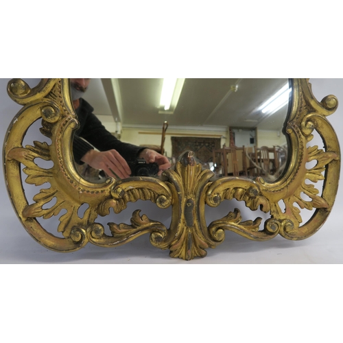 74 - A GEORGIAN DESIGN ROCOCO STYLE GILT MIRROR