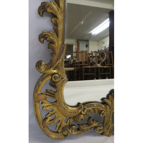 74 - A GEORGIAN DESIGN ROCOCO STYLE GILT MIRROR