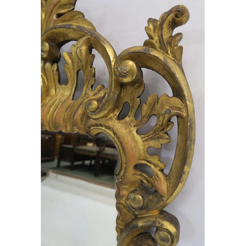 74 - A GEORGIAN DESIGN ROCOCO STYLE GILT MIRROR