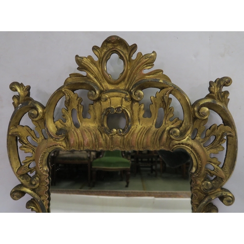 74 - A GEORGIAN DESIGN ROCOCO STYLE GILT MIRROR