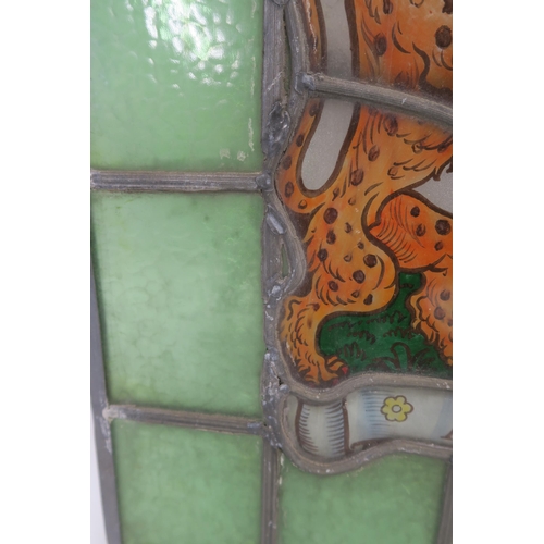 75 - A LEADED AND STAINED GLASS PANEL