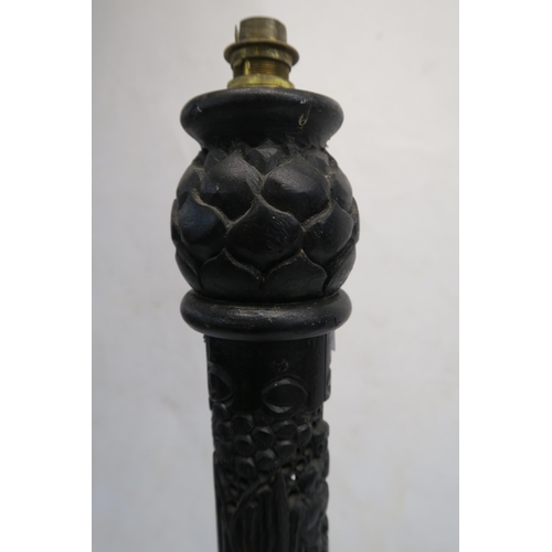 79 - A CHINESE CARVED AND STAINED WOOD STANDARD LAMP