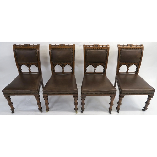 85 - A SET OF EIGHT PUGINESQUE OAK DINING CHAIRS