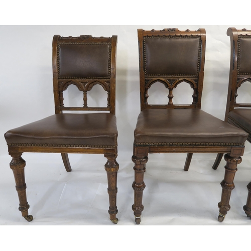 85 - A SET OF EIGHT PUGINESQUE OAK DINING CHAIRS