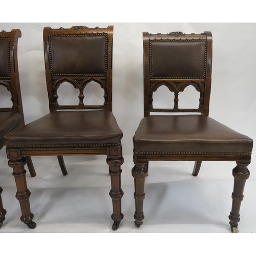 85 - A SET OF EIGHT PUGINESQUE OAK DINING CHAIRS