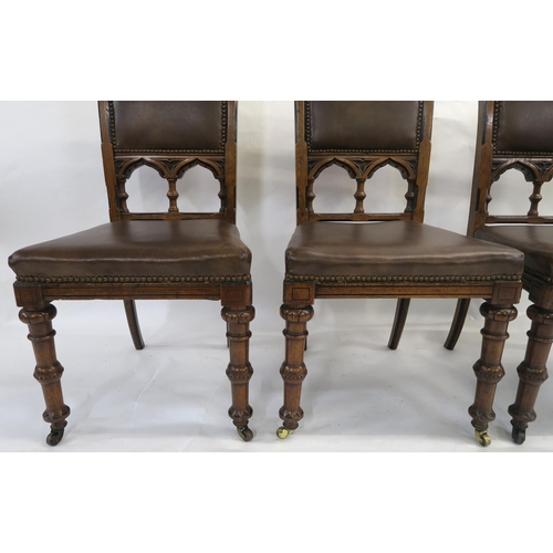 85 - A SET OF EIGHT PUGINESQUE OAK DINING CHAIRS