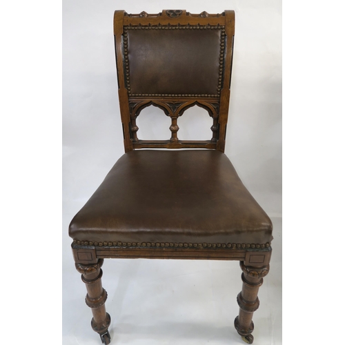 85 - A SET OF EIGHT PUGINESQUE OAK DINING CHAIRS