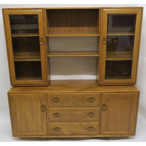 115 - AN ERCOL WINDSOR WALL DISPLAY UNIT