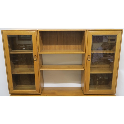 115 - AN ERCOL WINDSOR WALL DISPLAY UNIT