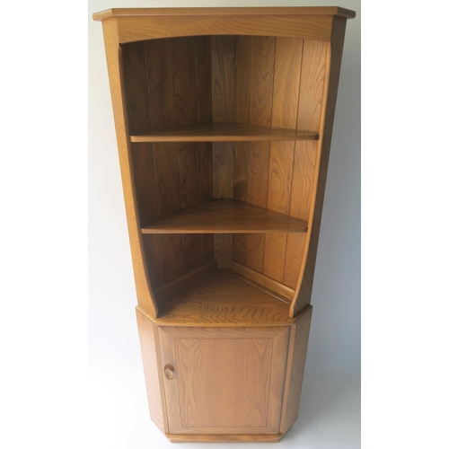 116 - AN ERCOL CORNER CABINET