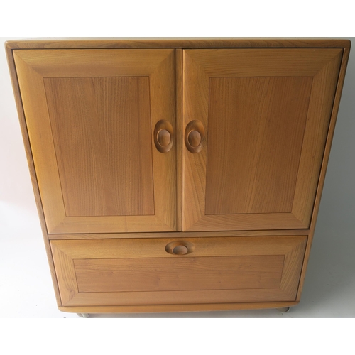 116 - AN ERCOL CORNER CABINET