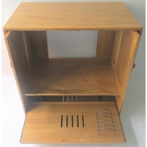 116 - AN ERCOL CORNER CABINET