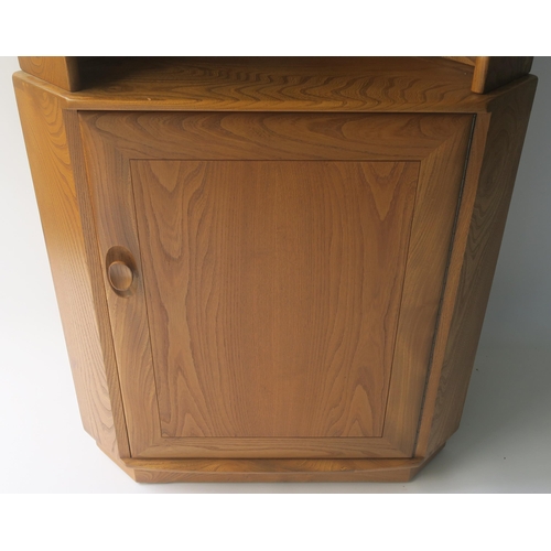 116 - AN ERCOL CORNER CABINET