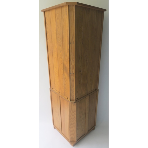 116 - AN ERCOL CORNER CABINET