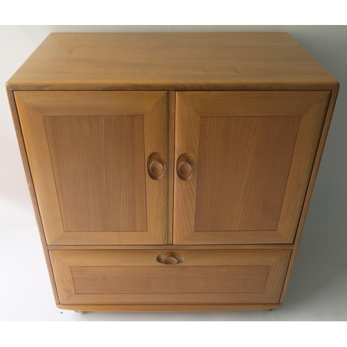 116 - AN ERCOL CORNER CABINET