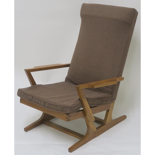 123B - A MID CENTURY  UPHOLSTERED ELM ARMCHAIR