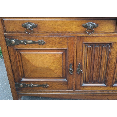 36 - AN ARTS AND CRAFTS OAK SIDEBOARD