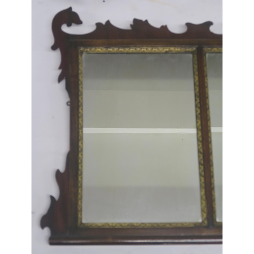 64 - A GEORGIAN STYLE WALNUT TRIPTYCH MIRROR WITH CARVED FRAME