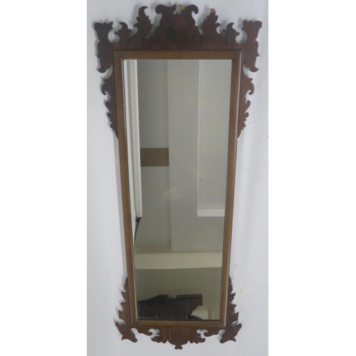 64 - A GEORGIAN STYLE WALNUT TRIPTYCH MIRROR WITH CARVED FRAME