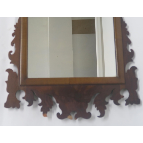 64 - A GEORGIAN STYLE WALNUT TRIPTYCH MIRROR WITH CARVED FRAME